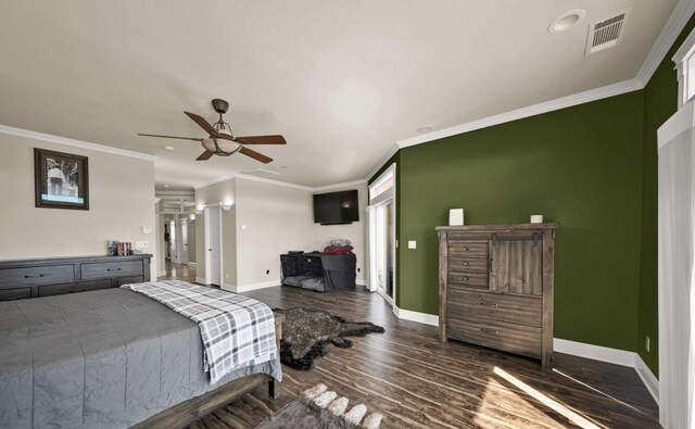 bedroom featuring ornamental molding, dark wood-type flooring, and ceiling fan