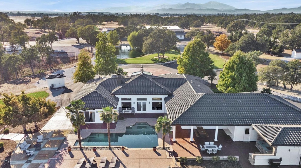 birds eye view of property with a mountain view