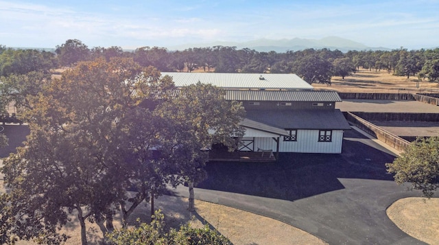 birds eye view of property with a rural view