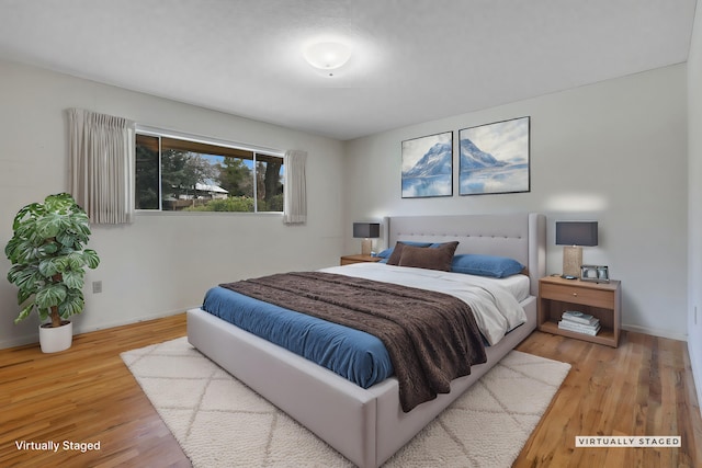 bedroom with light hardwood / wood-style flooring