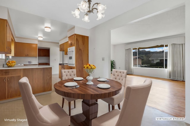 dining area with a notable chandelier