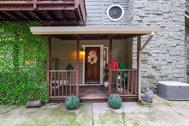 property entrance featuring stone siding