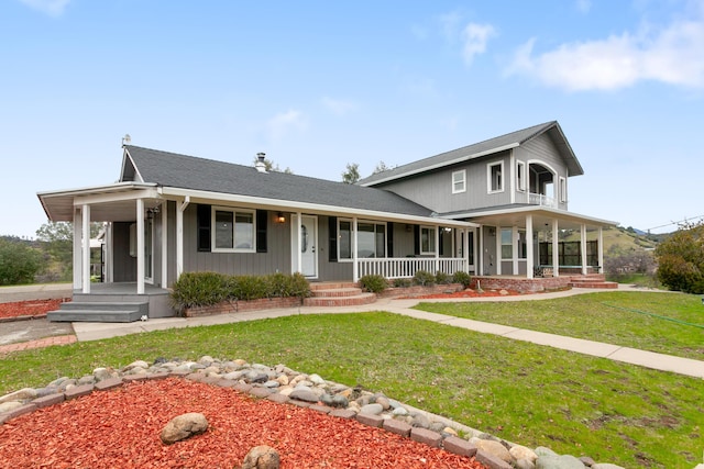 farmhouse-style home with covered porch and a front yard