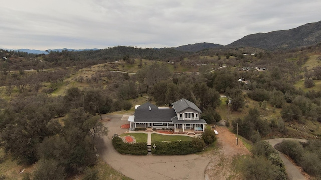 birds eye view of property featuring a mountain view