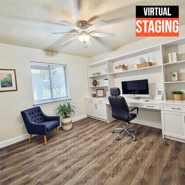 office with dark hardwood / wood-style flooring, ceiling fan, built in desk, and a textured ceiling