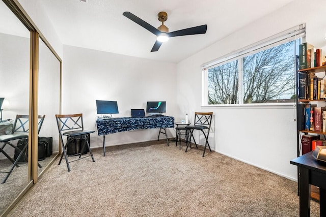 carpeted bedroom featuring baseboards, a ceiling fan, and a closet