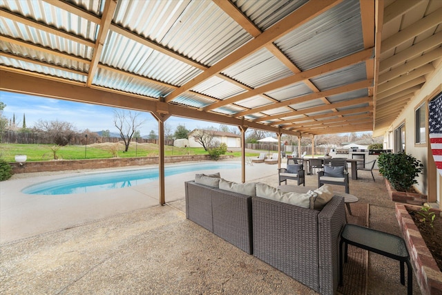 view of patio / terrace with outdoor dining space, an outdoor pool, and an outdoor living space