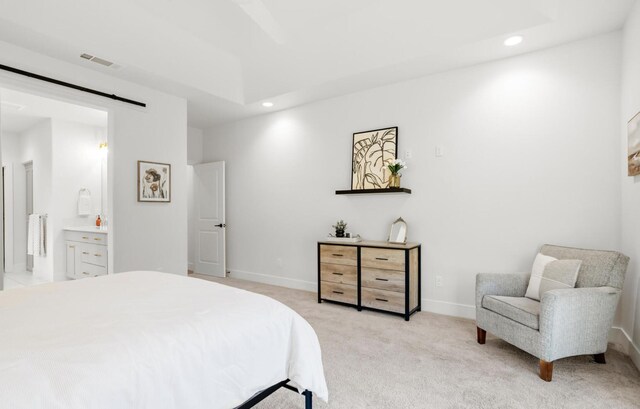 bedroom with recessed lighting, light colored carpet, visible vents, a barn door, and baseboards