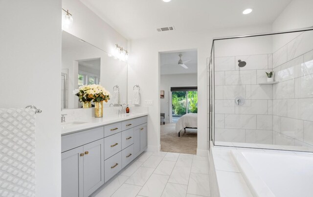 bathroom with a sink, double vanity, connected bathroom, and visible vents