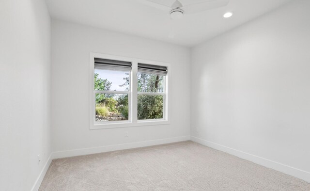 spare room with carpet, baseboards, and recessed lighting