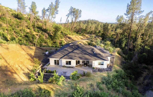 aerial view featuring a wooded view