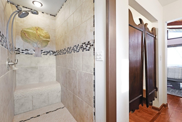 bathroom with tiled shower