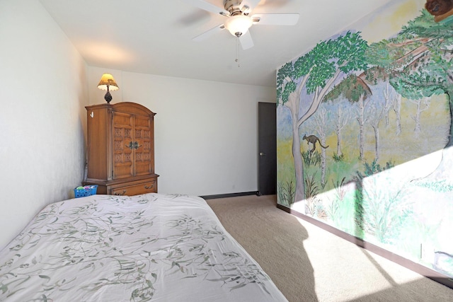 carpeted bedroom featuring a ceiling fan and baseboards