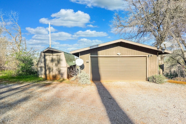 garage featuring a storage unit