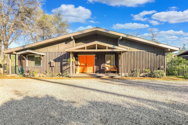 view of front of house featuring covered porch and board and batten siding