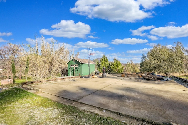 exterior space featuring an outbuilding and a storage unit