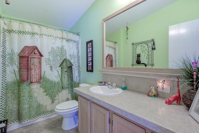 full bathroom featuring toilet, vanity, and tile patterned floors