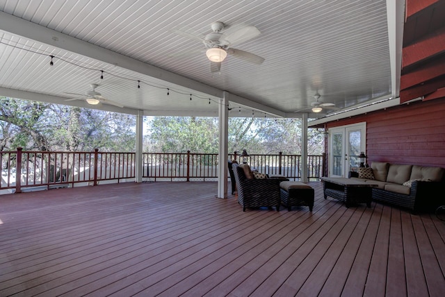 wooden terrace featuring ceiling fan and an outdoor hangout area