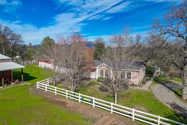 view of yard featuring a rural view and driveway