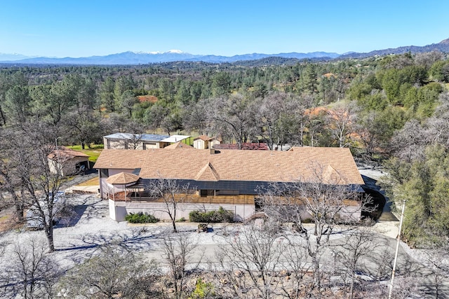 aerial view featuring a mountain view and a wooded view