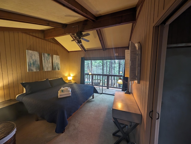 bedroom with wooden walls, lofted ceiling with beams, ceiling fan, access to exterior, and carpet