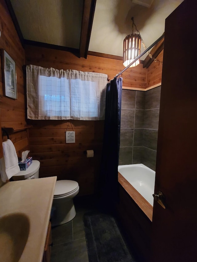 full bathroom featuring shower / bath combo, wood walls, vanity, and toilet