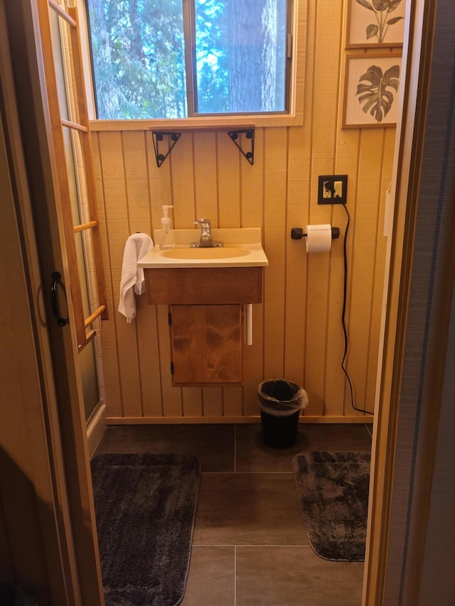 bathroom with wood finished floors and vanity