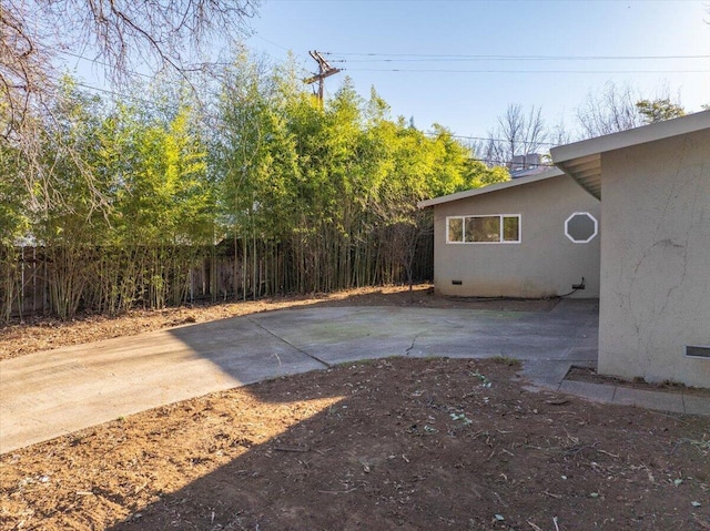 view of yard with a patio area and fence