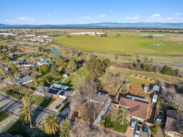 bird's eye view featuring a water and mountain view