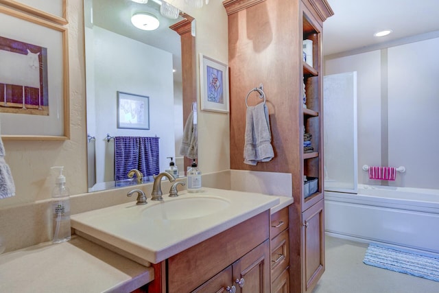 full bathroom featuring combined bath / shower with glass door and vanity