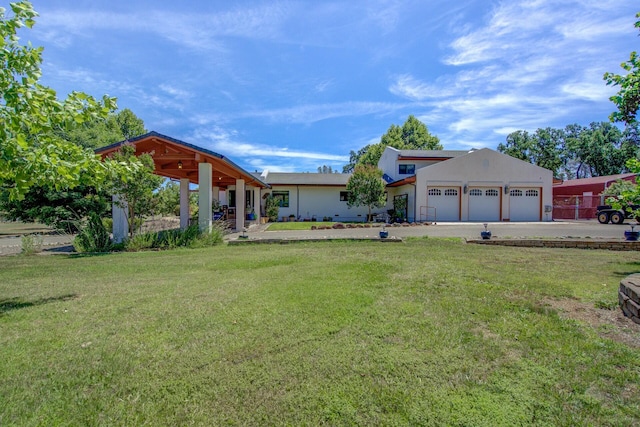 view of front facade with an attached garage and a front lawn