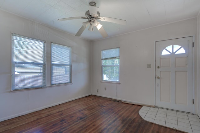 entrance foyer featuring dark wood-type flooring, visible vents, and a ceiling fan