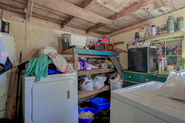 clothes washing area featuring laundry area, washer / clothes dryer, and wooden ceiling