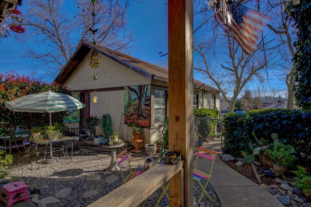 view of patio / terrace featuring fence and an outdoor structure