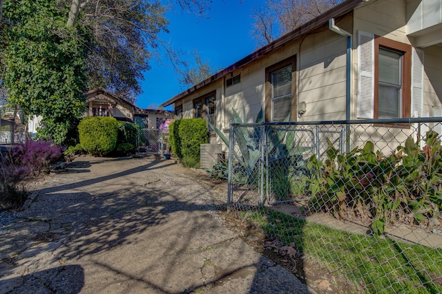 view of home's exterior with fence
