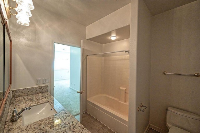 bathroom with shower / washtub combination, vanity, toilet, and tile patterned floors