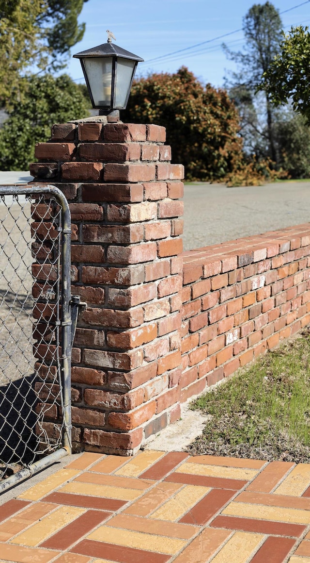 view of gate with fence