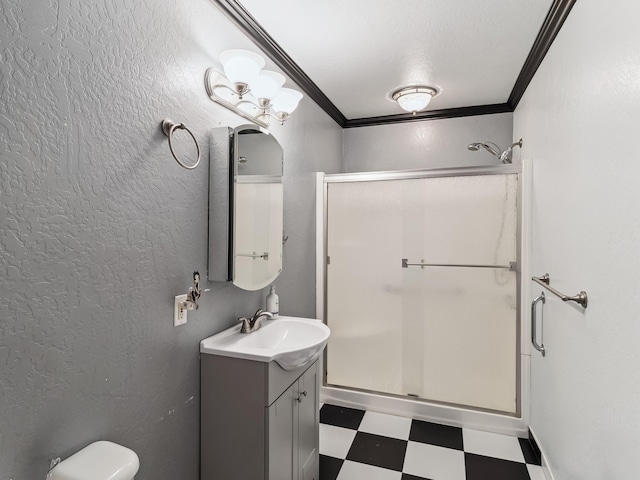 bathroom featuring a stall shower, vanity, ornamental molding, and tile patterned floors