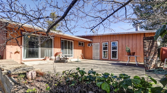 back of property with a wooden deck