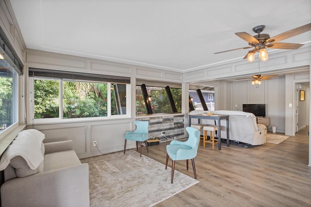 sunroom / solarium with ceiling fan and a wealth of natural light