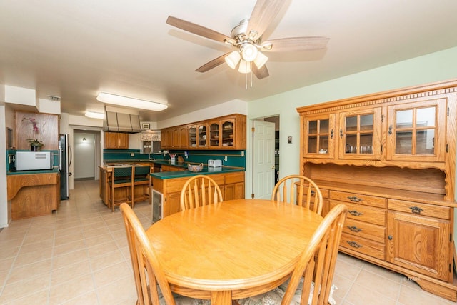 dining area featuring visible vents, ceiling fan, and light tile patterned floors