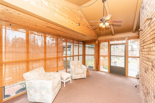 sunroom / solarium with vaulted ceiling and a ceiling fan