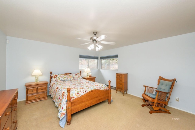 bedroom featuring baseboards, light carpet, ceiling fan, and baseboard heating