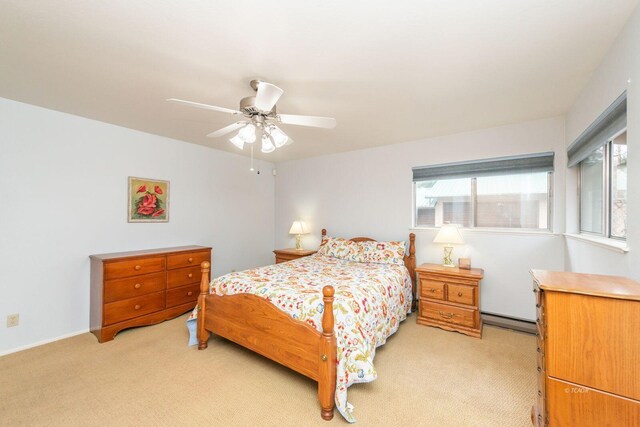 bedroom with light carpet, ceiling fan, multiple windows, and a baseboard radiator