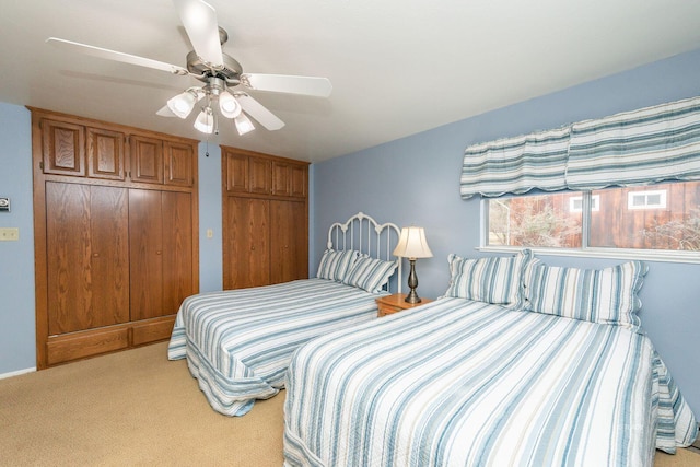 bedroom featuring ceiling fan and carpet flooring