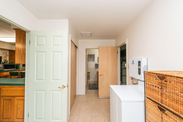 interior space featuring visible vents and light tile patterned flooring