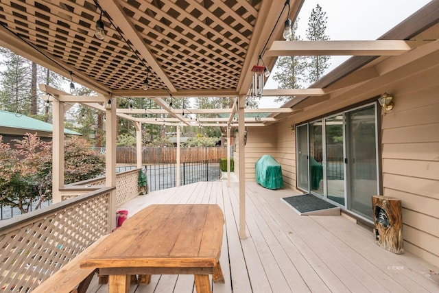 deck with fence and a pergola