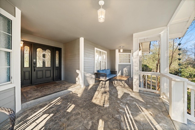 property entrance featuring a porch