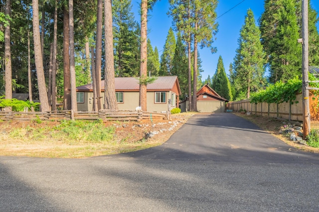 view of front of home featuring fence and stucco siding