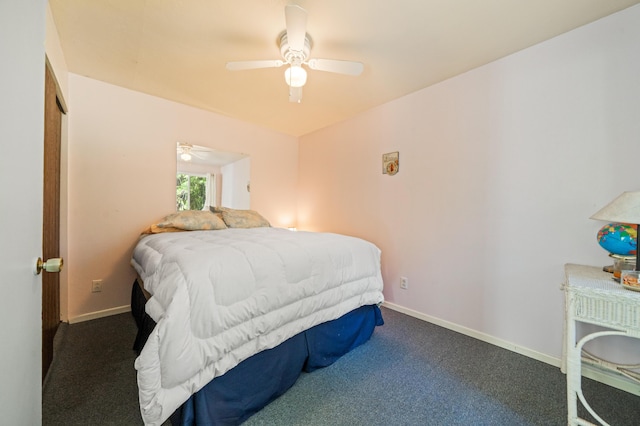 bedroom featuring ceiling fan, dark carpet, and baseboards